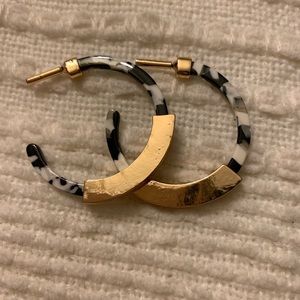 White and black with gold tone earrings